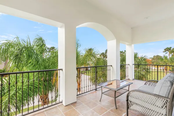 a view of a balcony with furniture