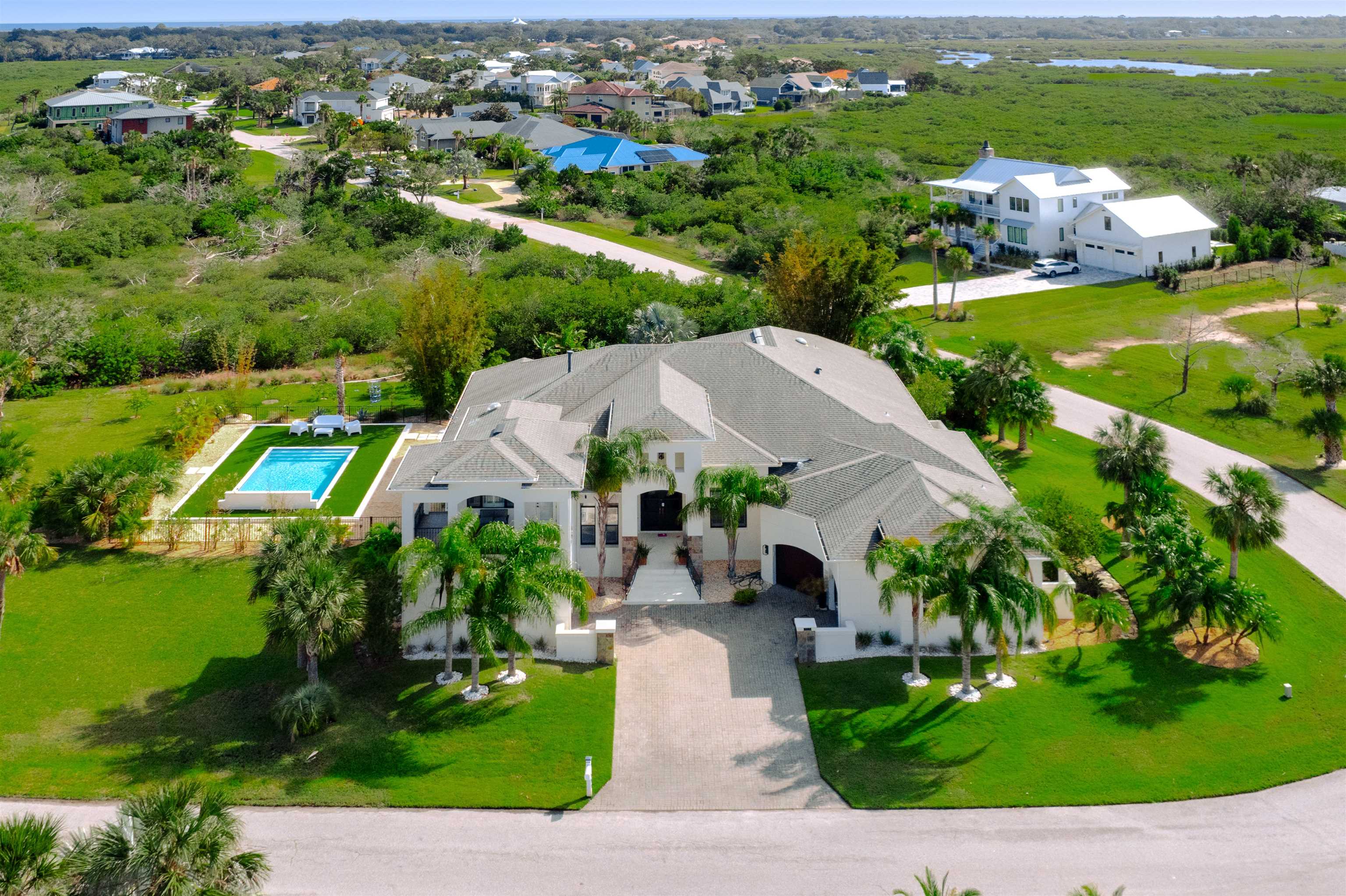 151 Pelican Reef Drive St. Augustine, FL 32080 - Photo 25 of 29 an aerial view of residential houses with outdoor space and trees