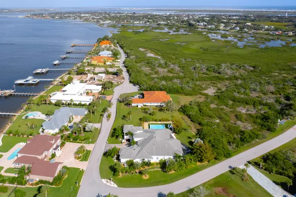 an aerial view of a house with a ocean view