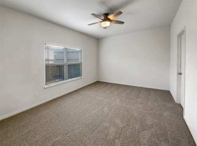 a white bath tub sitting next to a shower