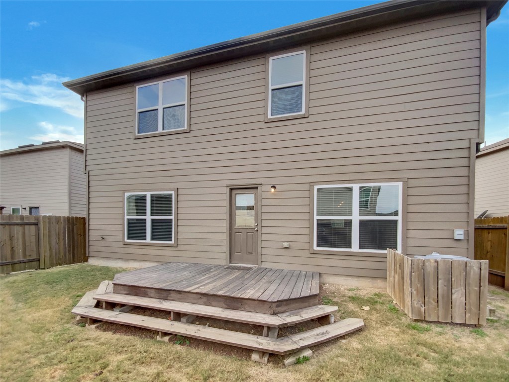 138 Niven Path, Unit 26E Jarrell, TX 76537 - Photo 5 of 21 a view of a house with a bed and a yard
