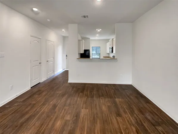 a kitchen with granite countertop a sink and a stove