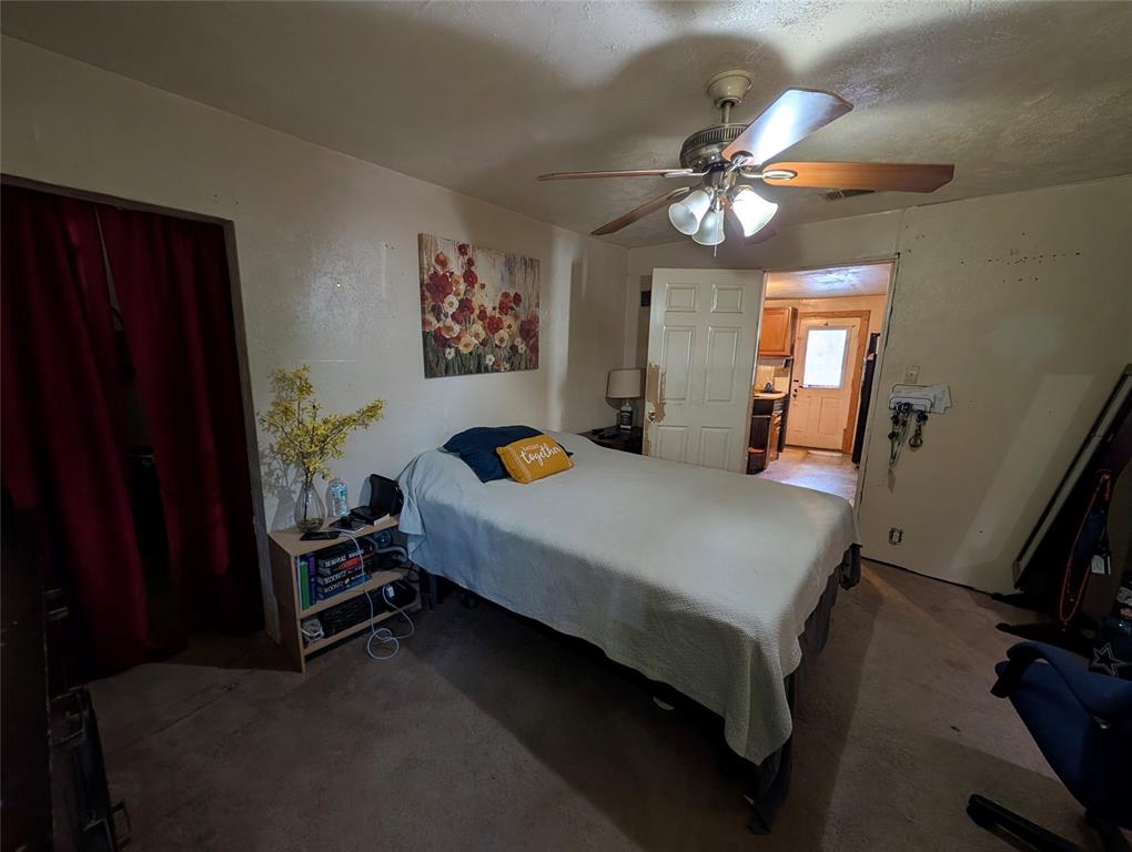308 Short Street Mansfield, TX 76063 - Photo 11 of 21 a bedroom with a bed and a chandelier