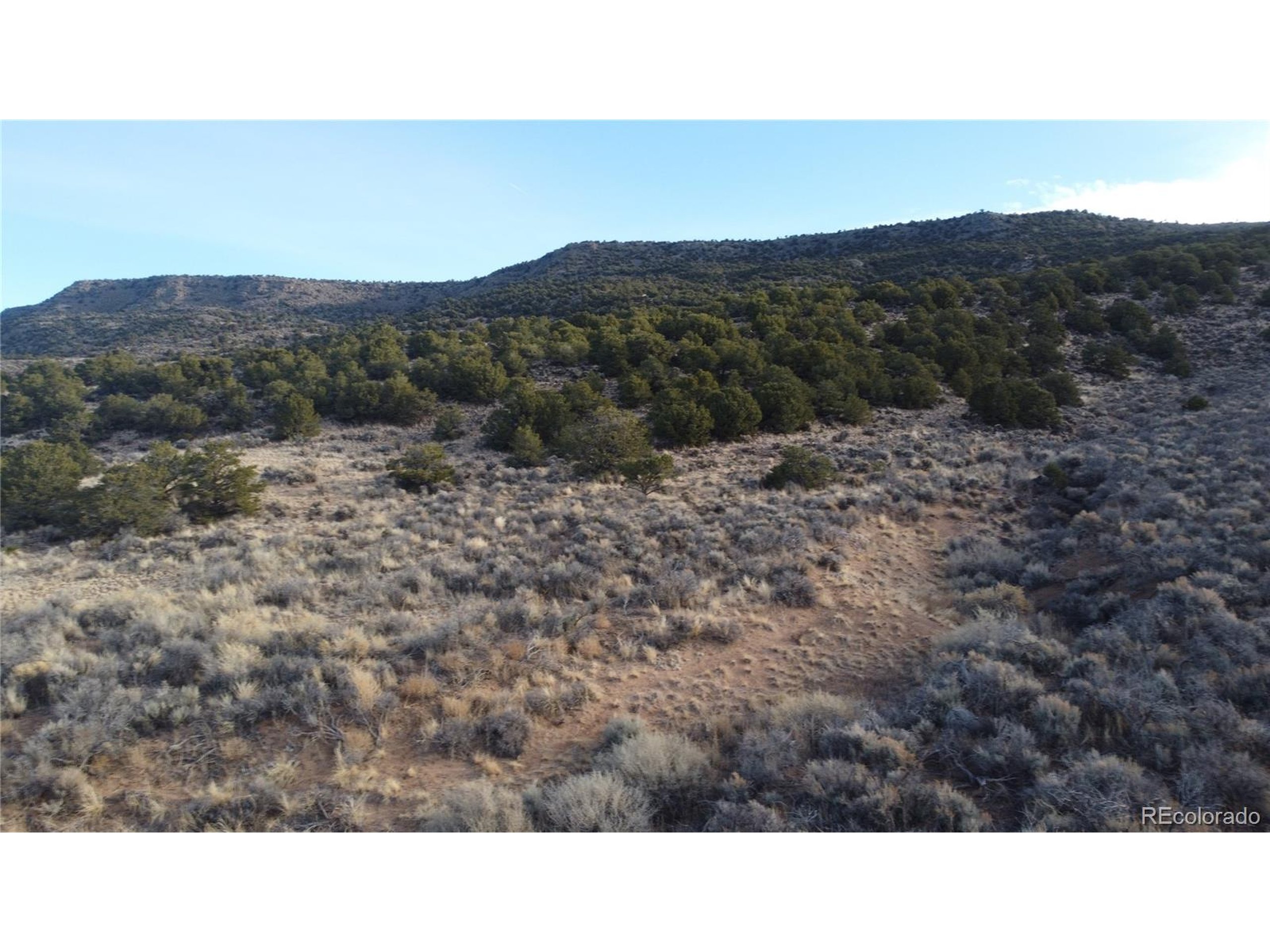 54 Old Stage Coach Road San Luis, CO 81152 - Photo 19 of 20 a open area with mountains in the background