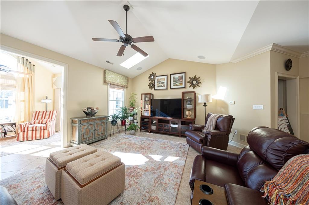 408 Independence Lane Freedom, PA 15042 - Photo 7 of 26 a living room with furniture a fireplace and a flat screen tv