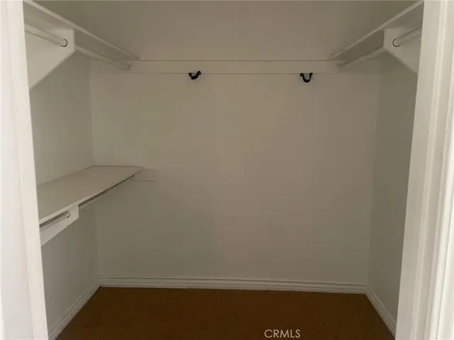 a kitchen with granite countertop a sink stove and cabinets