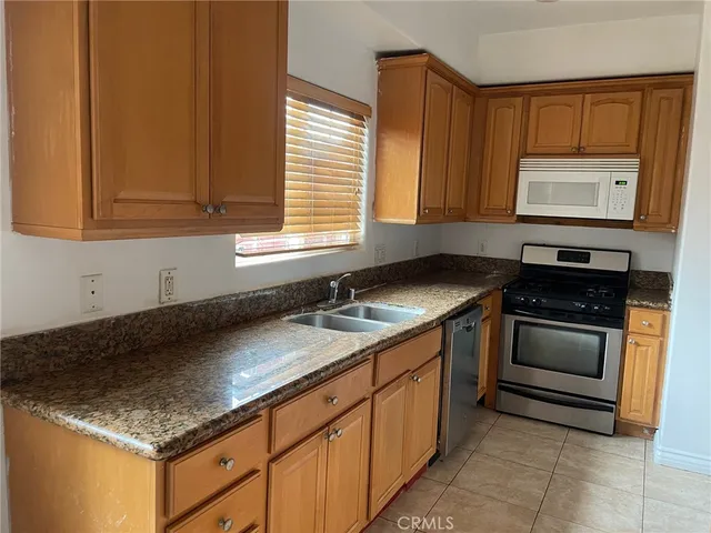 a view of a backyard of a house