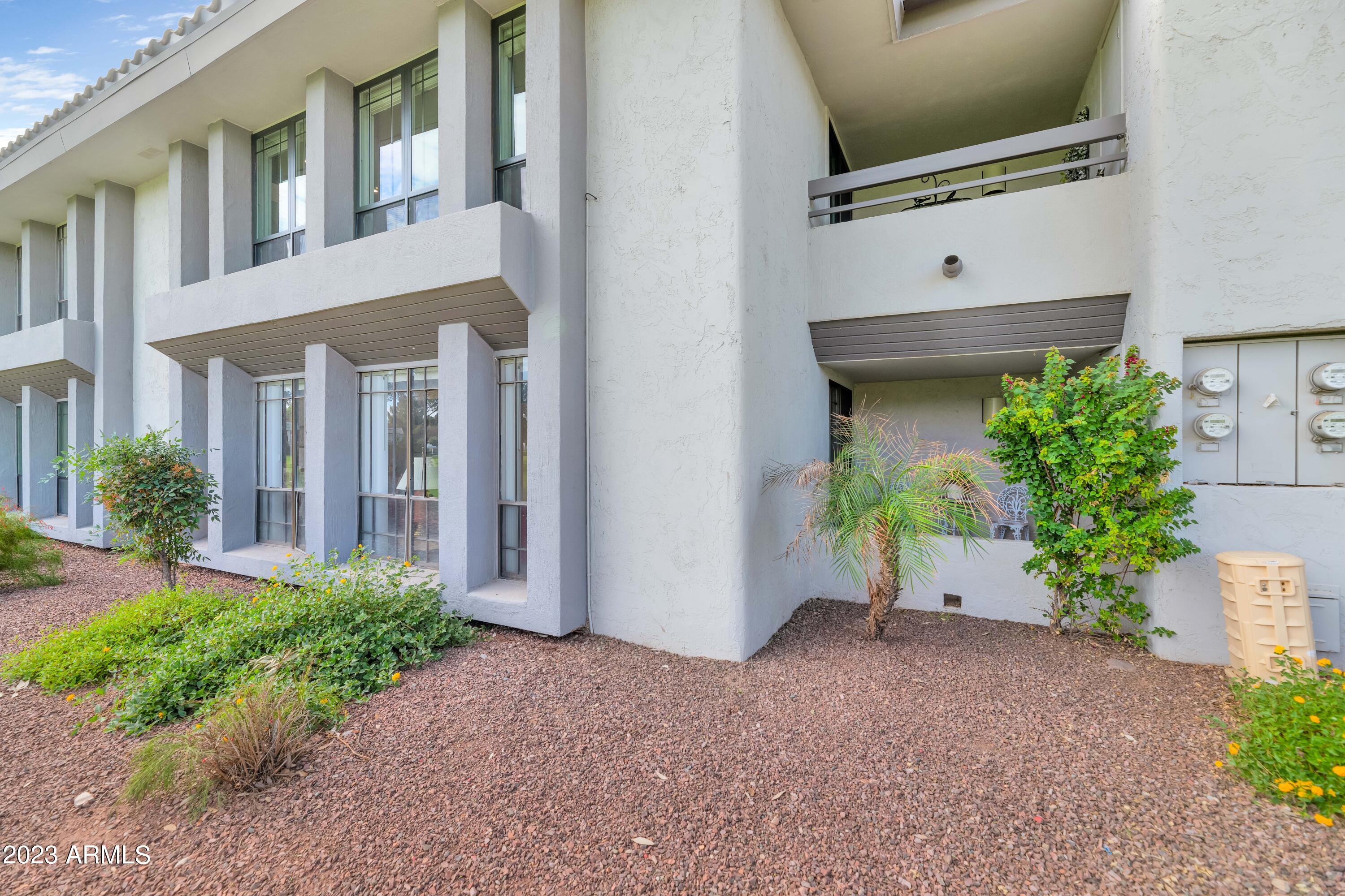 5223 North 24th Street, Unit 105 Phoenix, AZ 85016 - Photo 13 of 22 a front view of a house with garden