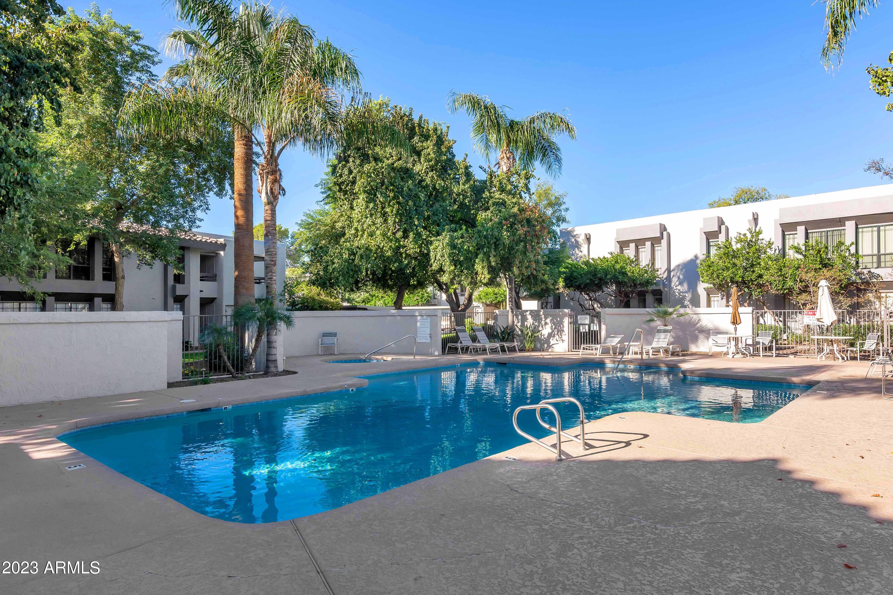 5223 North 24th Street, Unit 105 Phoenix, AZ 85016 - Photo 16 of 22 a view of a swimming pool with outdoor seating