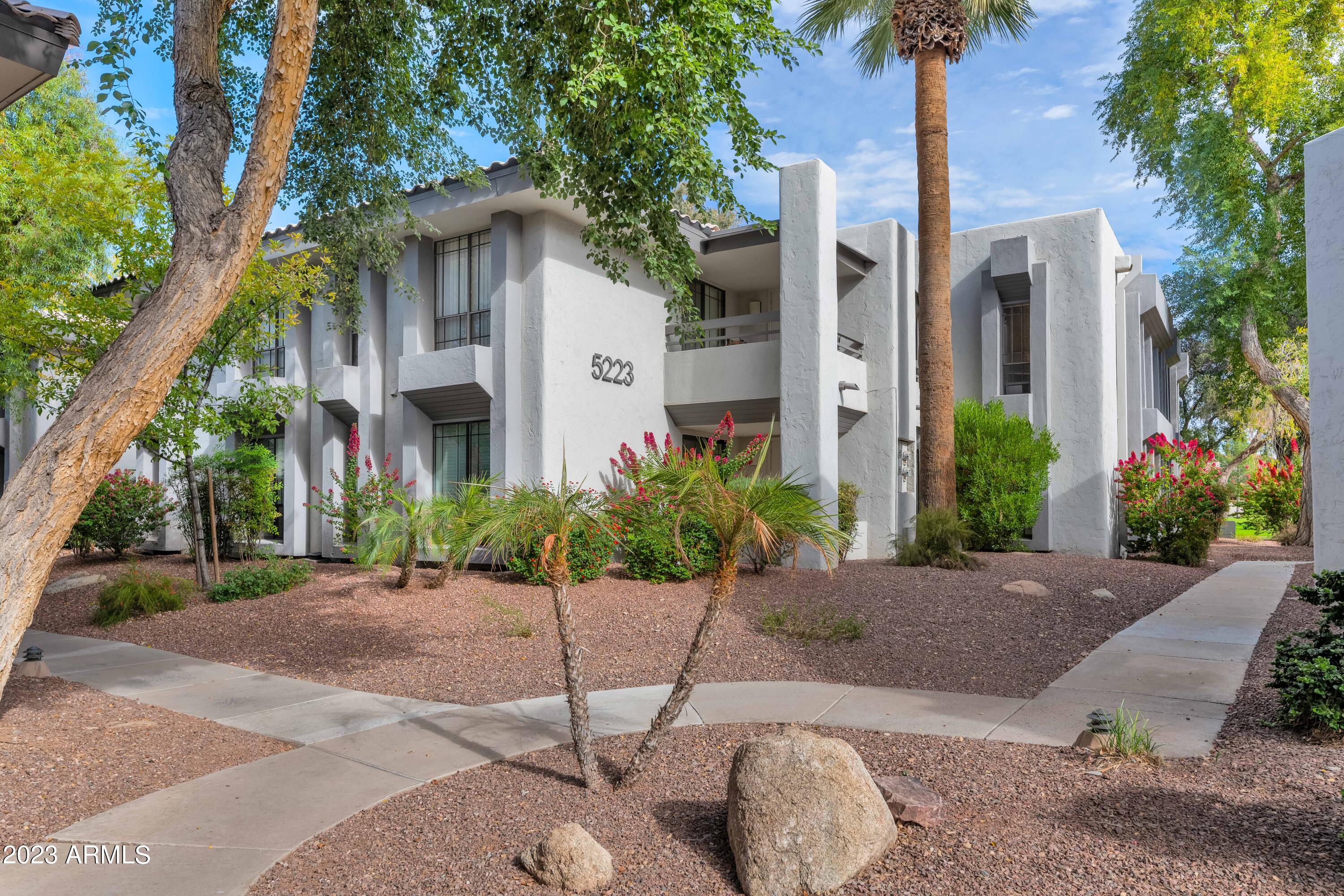 5223 North 24th Street, Unit 105 Phoenix, AZ 85016 - Photo 22 of 22 a front view of a house with garden