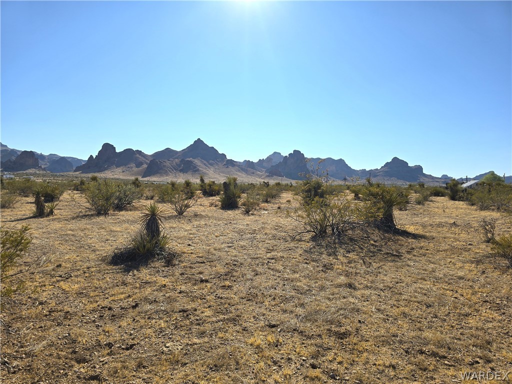 2821 Hopi Road Golden Valley, AZ 86413 - Photo 1 of 30 a view of a lake with mountains in the background