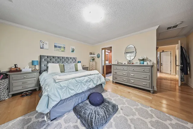 a bedroom with a bed and a dresser