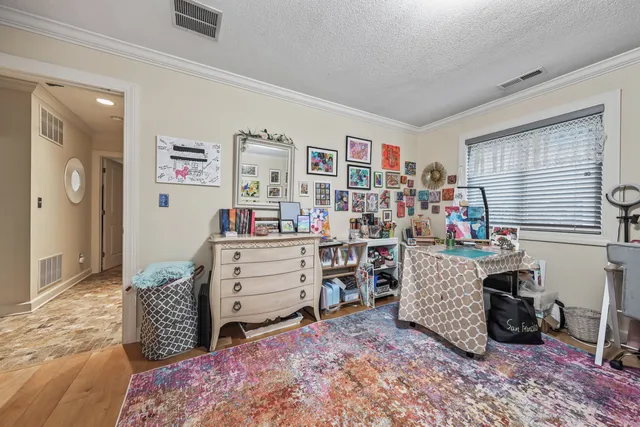 a bedroom with bed and a window