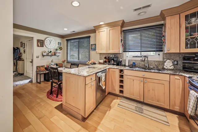 a kitchen with a sink stove and cabinets