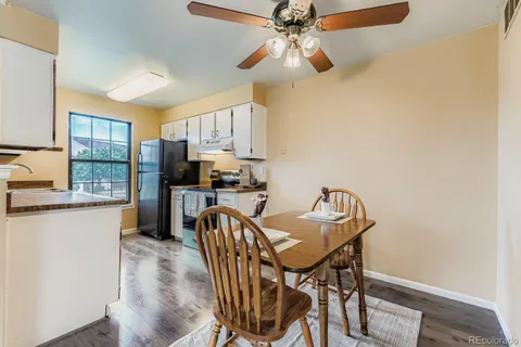 a view of a dining room with furniture and a chandelier