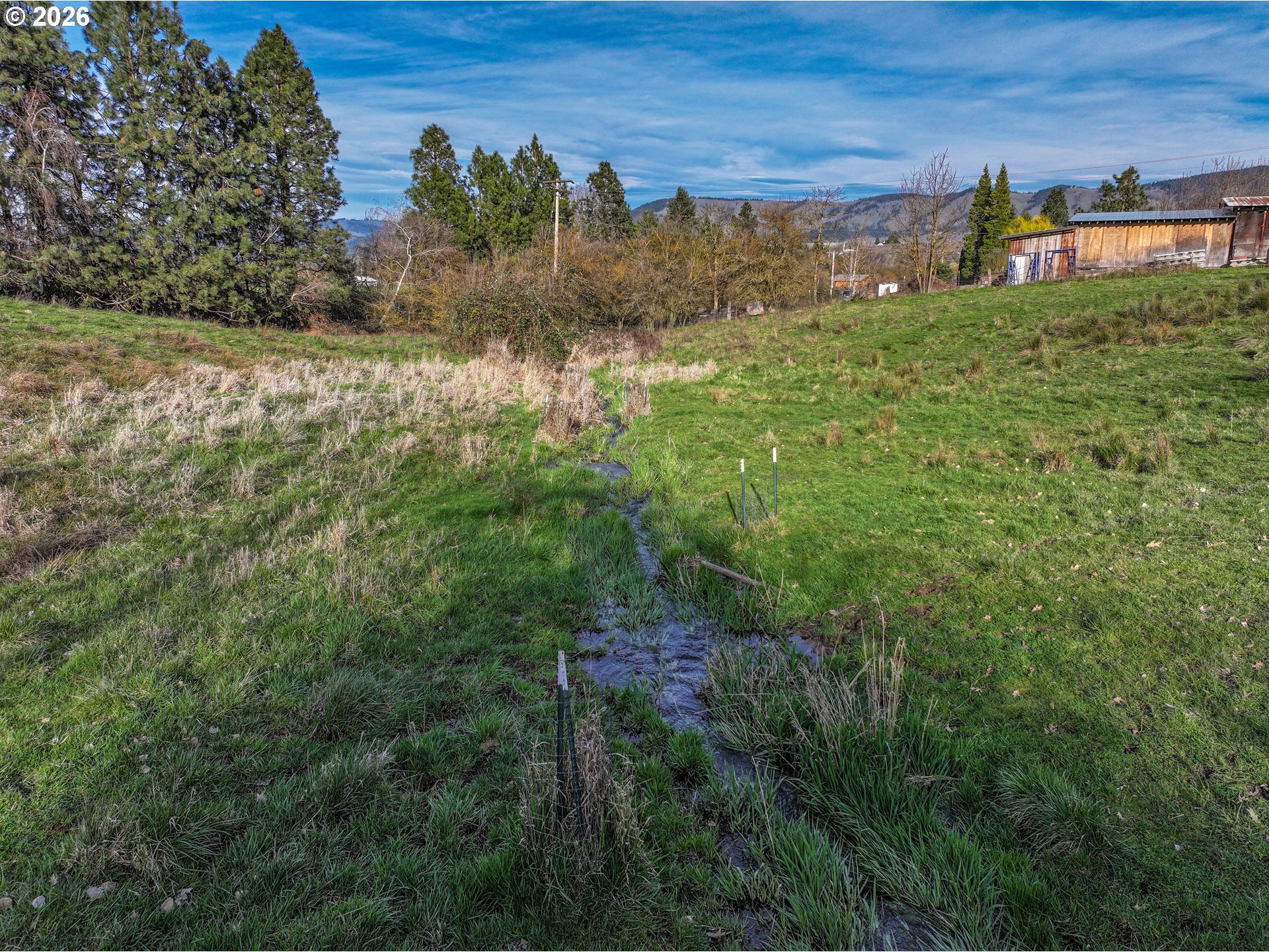 2739 Wyeast Road Hood River, OR 97031 - Photo 22 of 28 a view of a lake with a house in the background