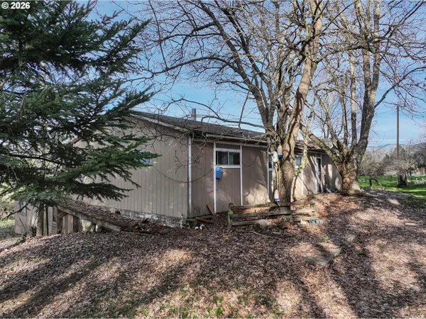 a house with trees in front of it