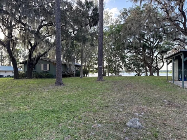 a view of a tree in front of a house