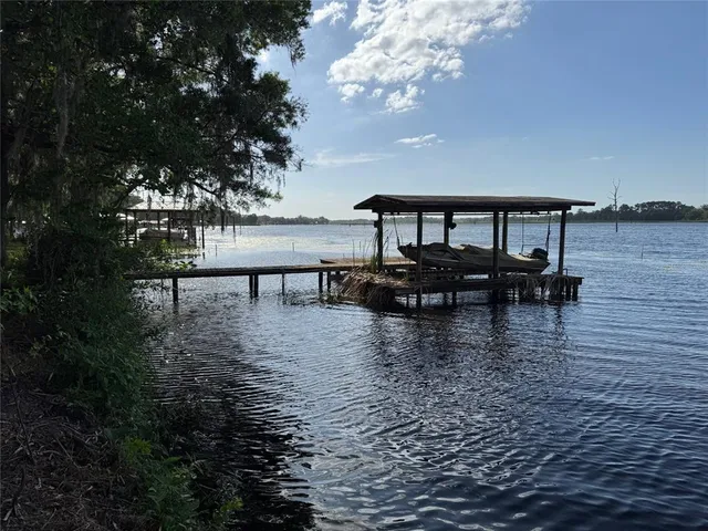 a view of a lake with outdoor seating