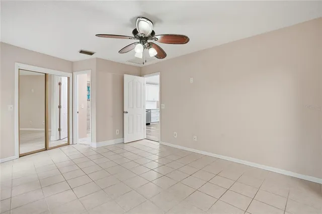 a view of room with window and ceiling fan