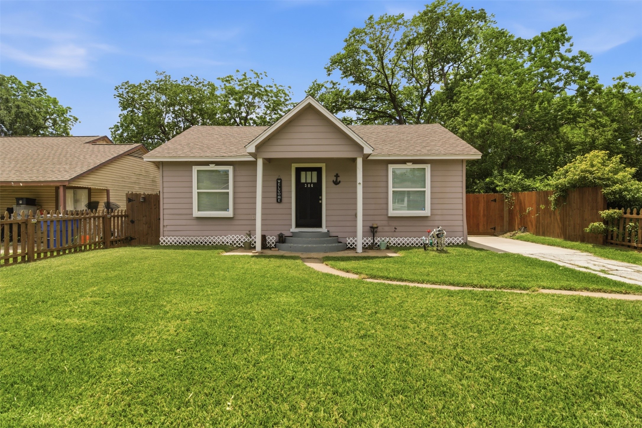 306 Center Street Pasadena, TX 77506 - Photo 1 of 31 a front view of a house with a yard and garage