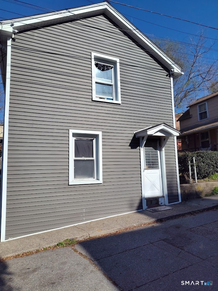 13 Rose Street Norwich, CT 06360 - Photo 1 of 21 a front view of a house with a garage