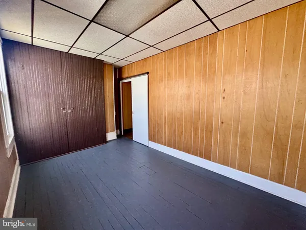 a view of a room with wooden walls