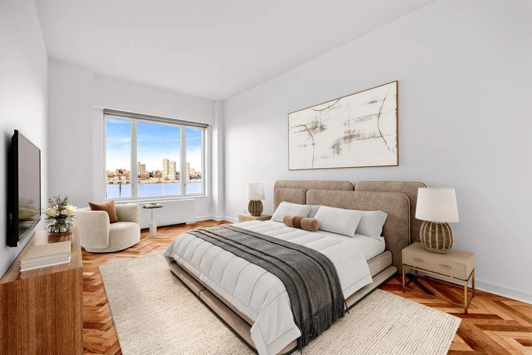 220 Riverside Boulevard, Unit 5L Manhattan, NY 10069 - Photo 6 of 16 a spacious bedroom with bed and a flat screen tv