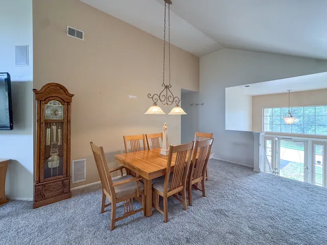 a dining room with furniture and window