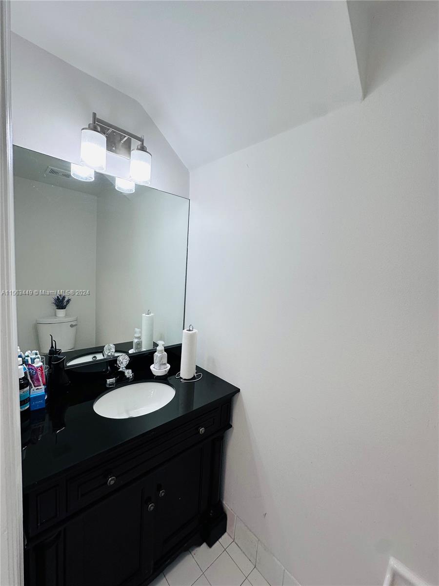 17456 Southwest 20th Street Miramar, FL 33029 - Photo 13 of 34 a bathroom with a sink and a mirror