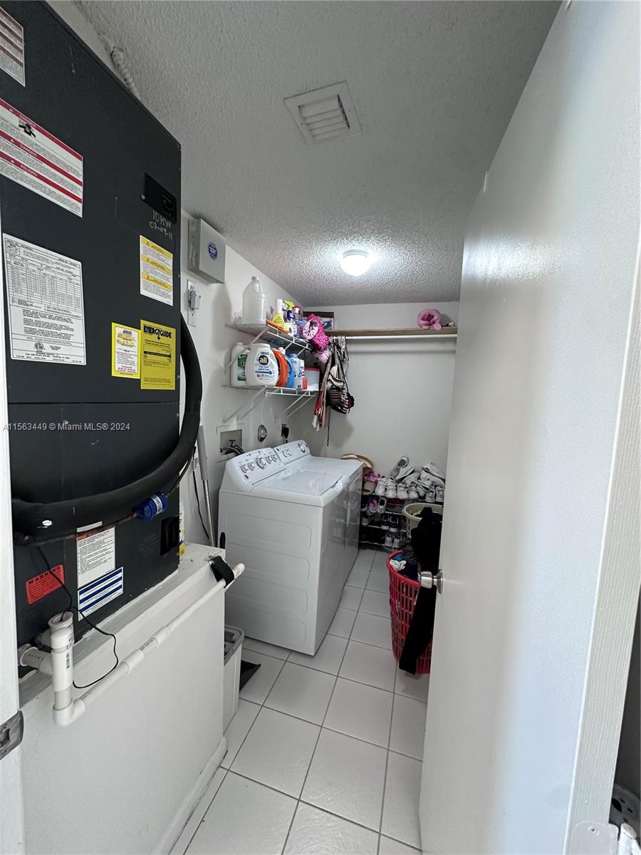 17456 Southwest 20th Street Miramar, FL 33029 - Photo 14 of 34 a room with a storage and utility