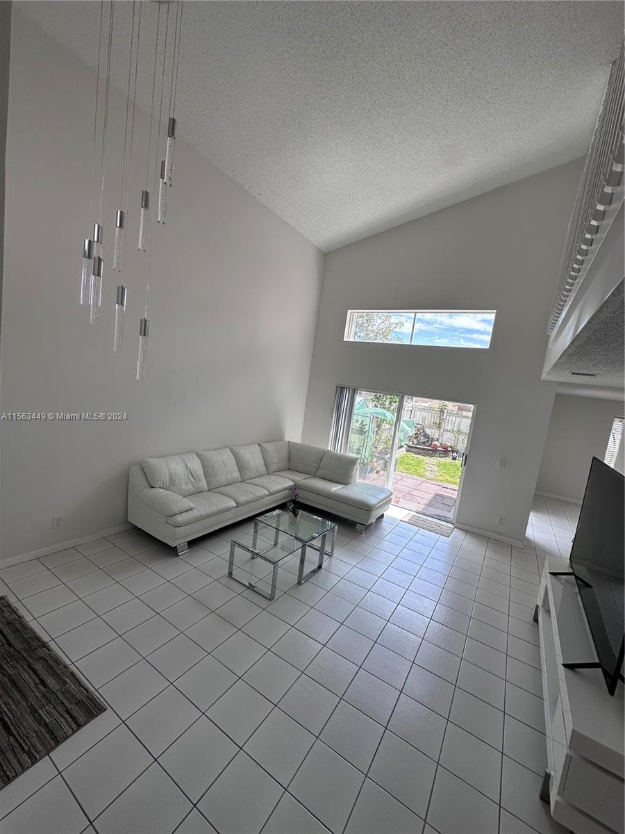 17456 Southwest 20th Street Miramar, FL 33029 - Photo 16 of 34 a living room with furniture and a couch