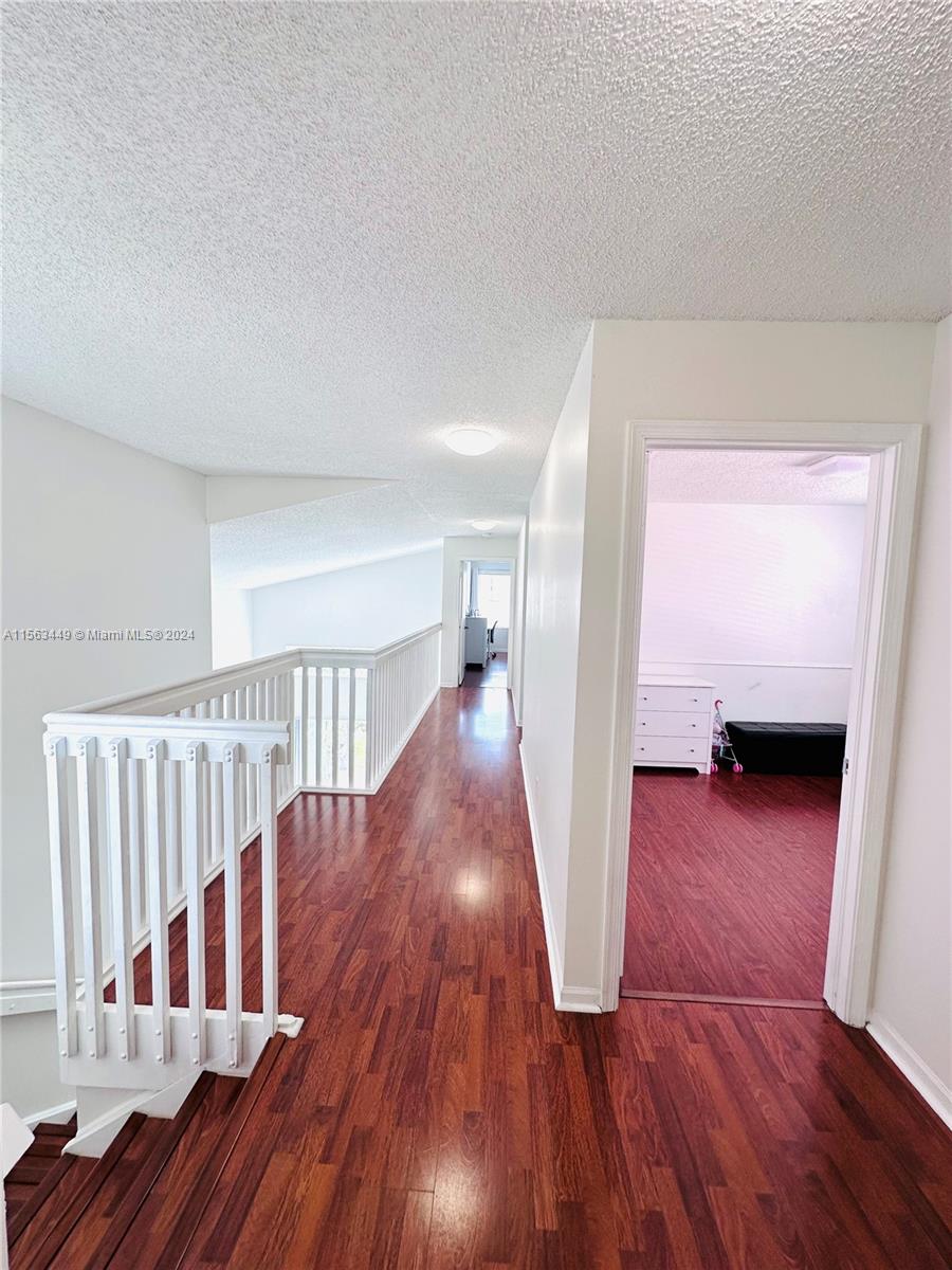 17456 Southwest 20th Street Miramar, FL 33029 - Photo 17 of 34 a view of livingroom with hardwood floor and stairs