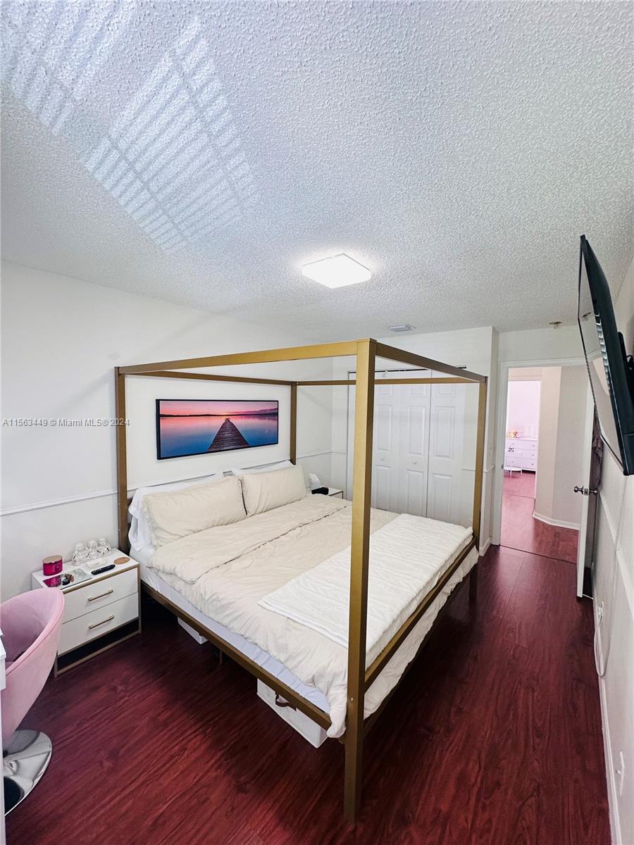 17456 Southwest 20th Street Miramar, FL 33029 - Photo 20 of 34 a bedroom with a bed and a dresser