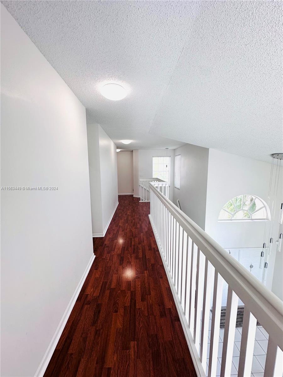 17456 Southwest 20th Street Miramar, FL 33029 - Photo 22 of 34 a view of a hallway with wooden floor