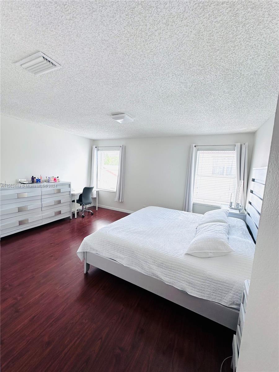 17456 Southwest 20th Street Miramar, FL 33029 - Photo 24 of 34 a bedroom with a bed and window