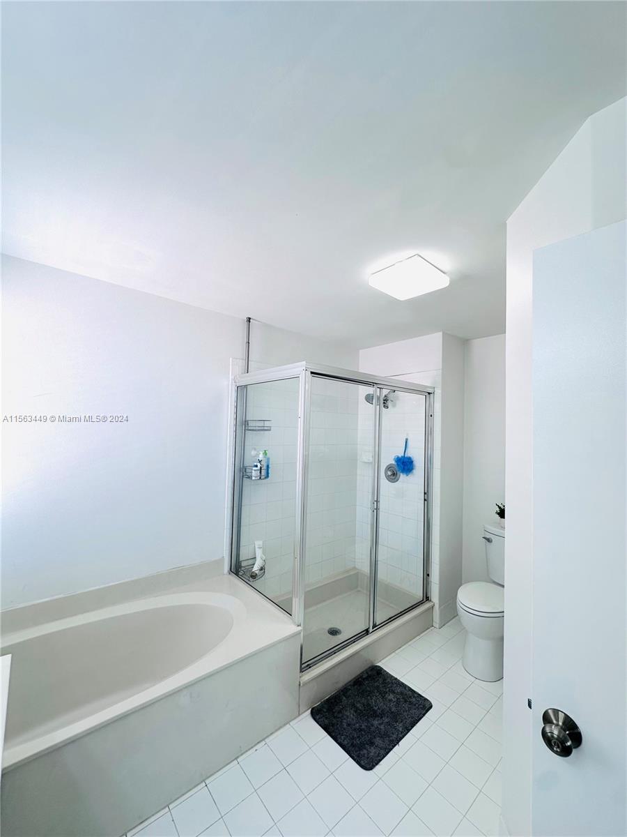 17456 Southwest 20th Street Miramar, FL 33029 - Photo 25 of 34 a bathroom with a shower and a toilet