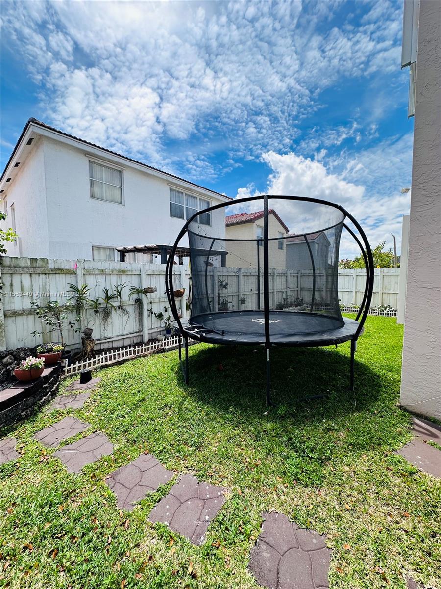 17456 Southwest 20th Street Miramar, FL 33029 - Photo 30 of 34 a view of a backyard with sitting area