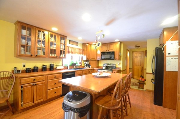 294 Old Hardwick Road Barre, MA 01005 - Photo 1 of 20 a kitchen with a table chairs stove and refrigerator