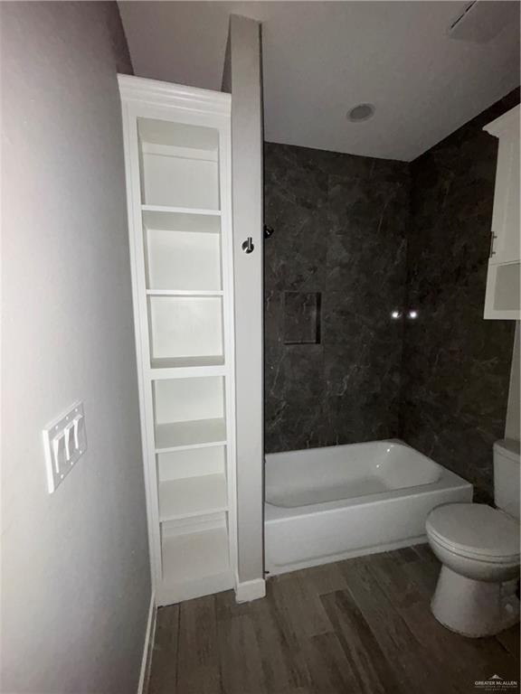 3056 Stark Road, Unit 2 Weslaco, TX 78596 - Photo 11 of 17 a bathroom with a bathtub and a shower