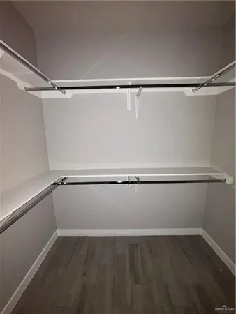 a view of an empty walk in closet