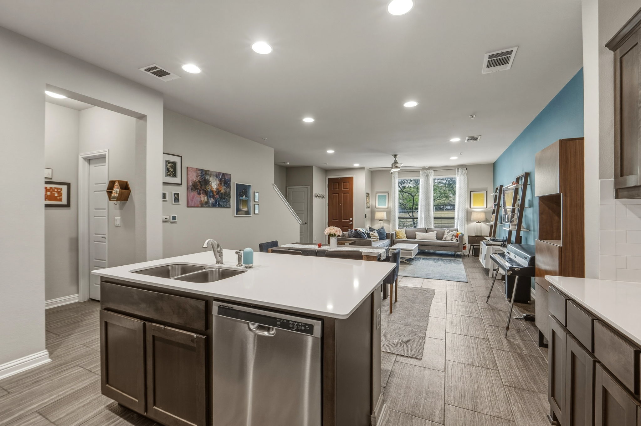 6814 East Riverside Drive, Unit 34 Austin, TX 78741 - Photo 12 of 26 a kitchen with a sink counter and chairs