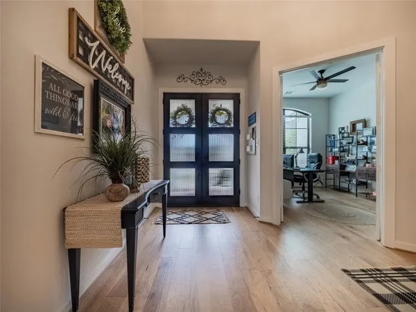 a view of a livingroom with furniture and hardwood floor
