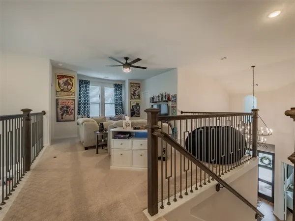 a view of walk in closet with clothes