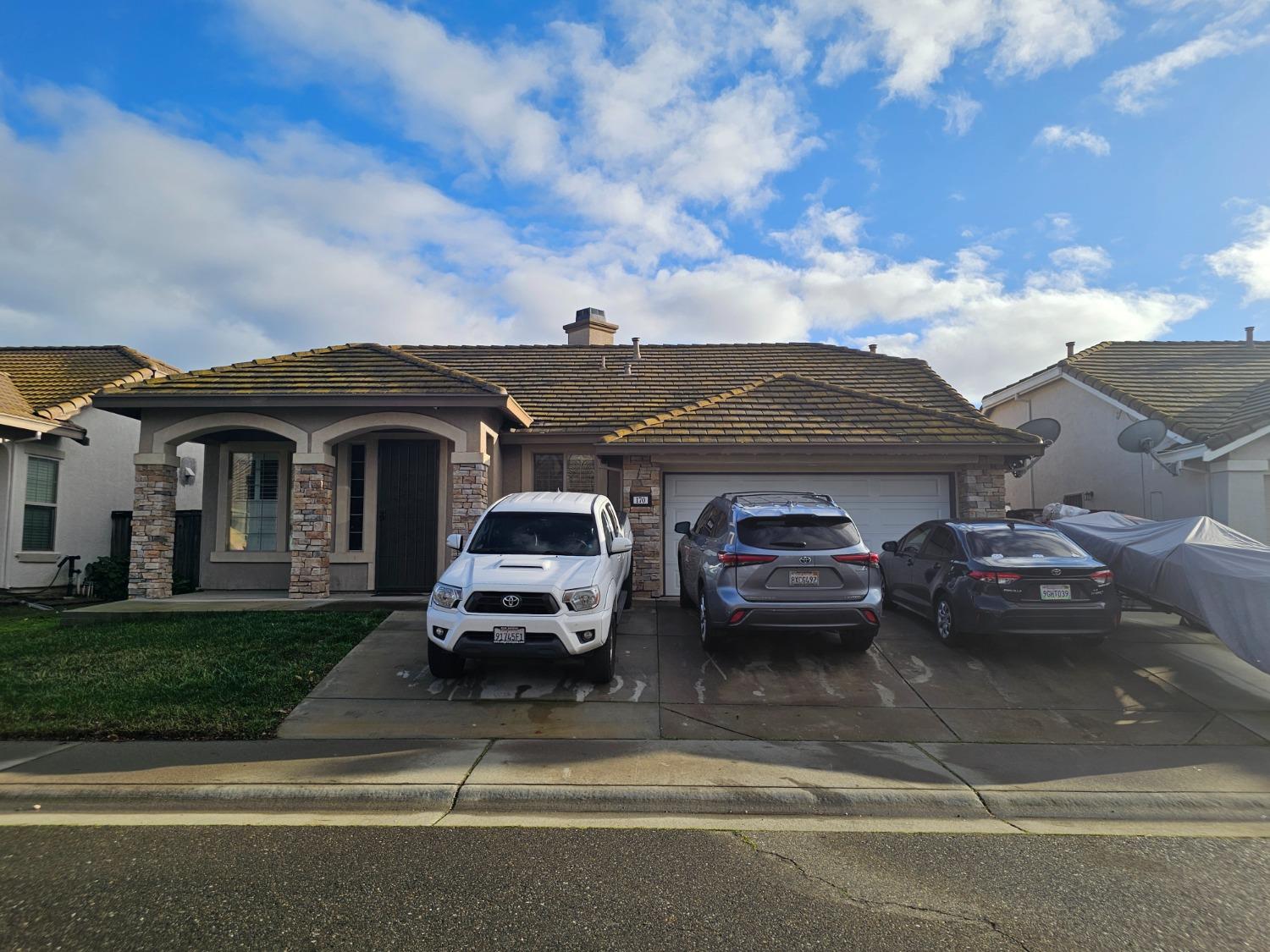a car parked in front of a house