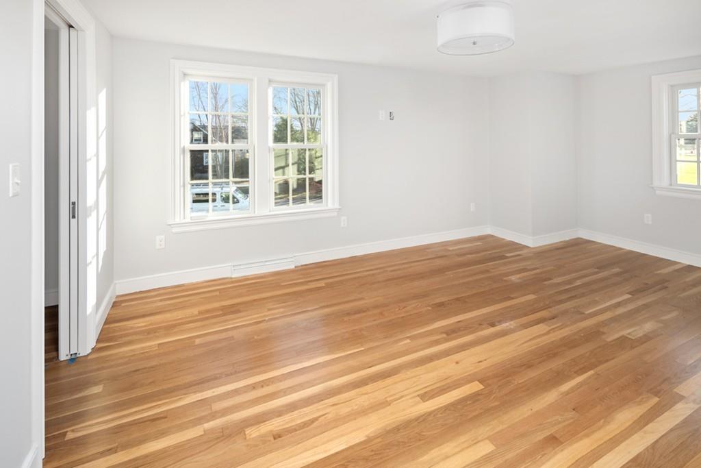 52 Union Street Hingham, MA 02043 - Photo 11 of 21 a view of empty room with wooden floor and fan