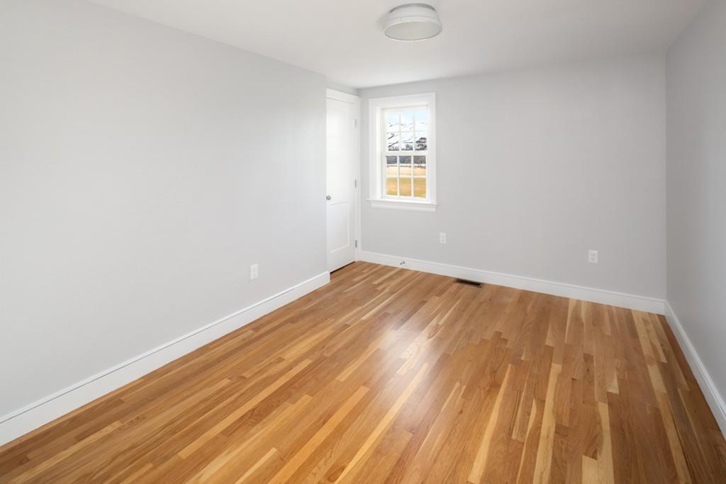 52 Union Street Hingham, MA 02043 - Photo 13 of 21 a view of a room with wooden floor and a window