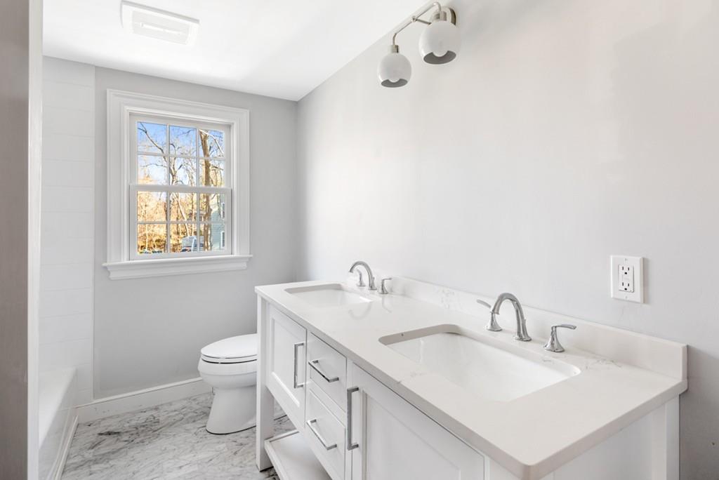 52 Union Street Hingham, MA 02043 - Photo 15 of 21 a bathroom with a sink toilet and vanity