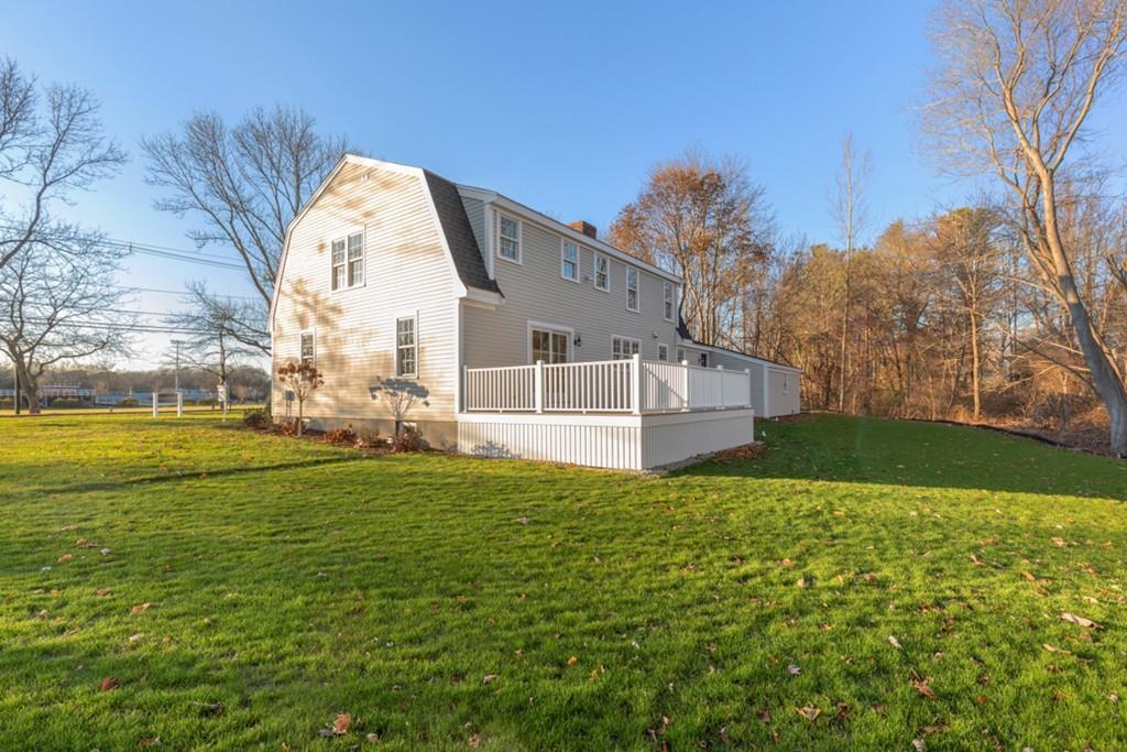 52 Union Street Hingham, MA 02043 - Photo 17 of 21 a view of a house with a big yard