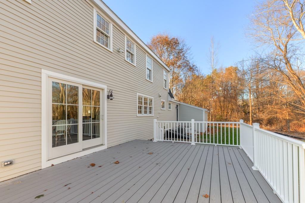 52 Union Street Hingham, MA 02043 - Photo 20 of 21 a view of a house with a wooden deck